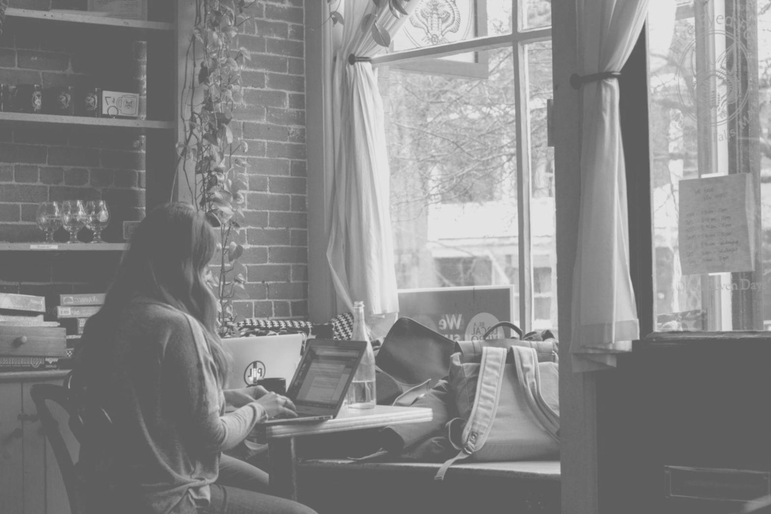 Modern office workspace with computer and design materials